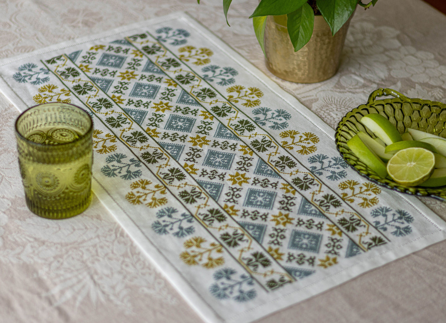 folk embroidery table runner in green and blue