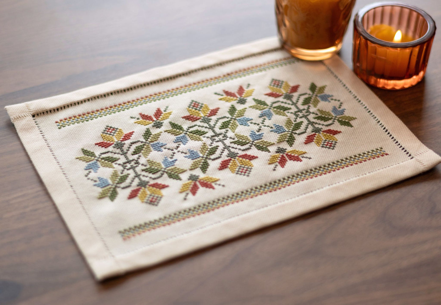 folk embroidery cross stitch table mat with leaves in fall palette