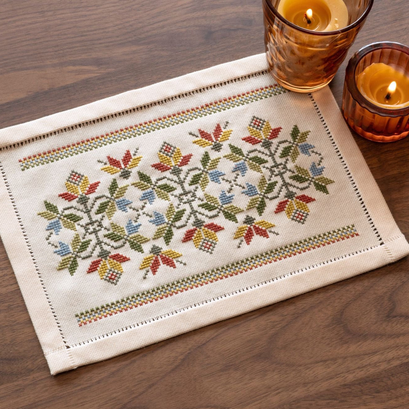 folk embroidery cross stitch table mat with leaves in fall palette