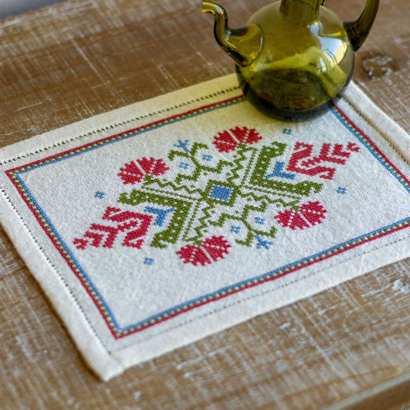 folk embroidery with red flower design