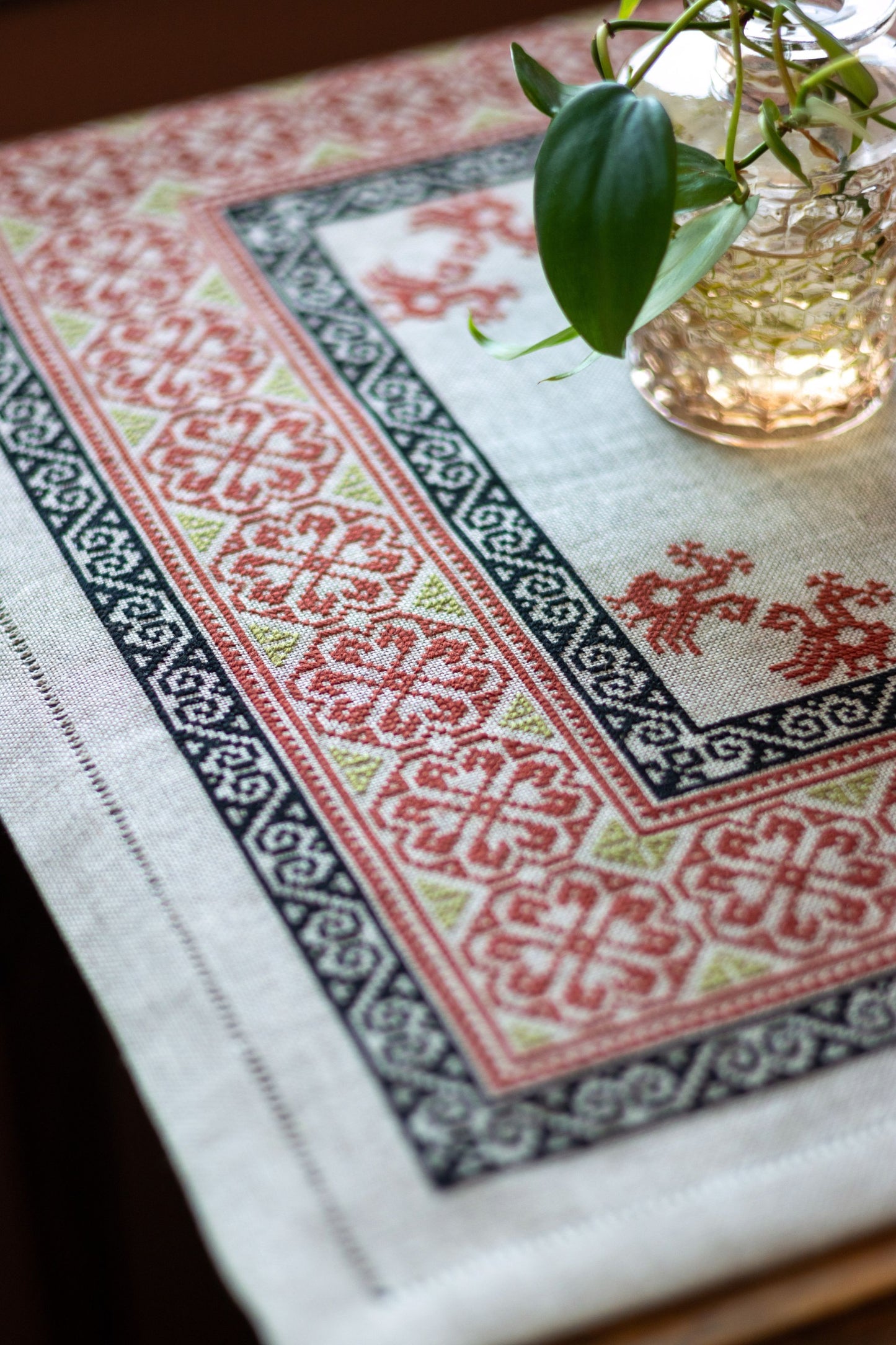 Decorative tablecloth with intricate patterns on a table