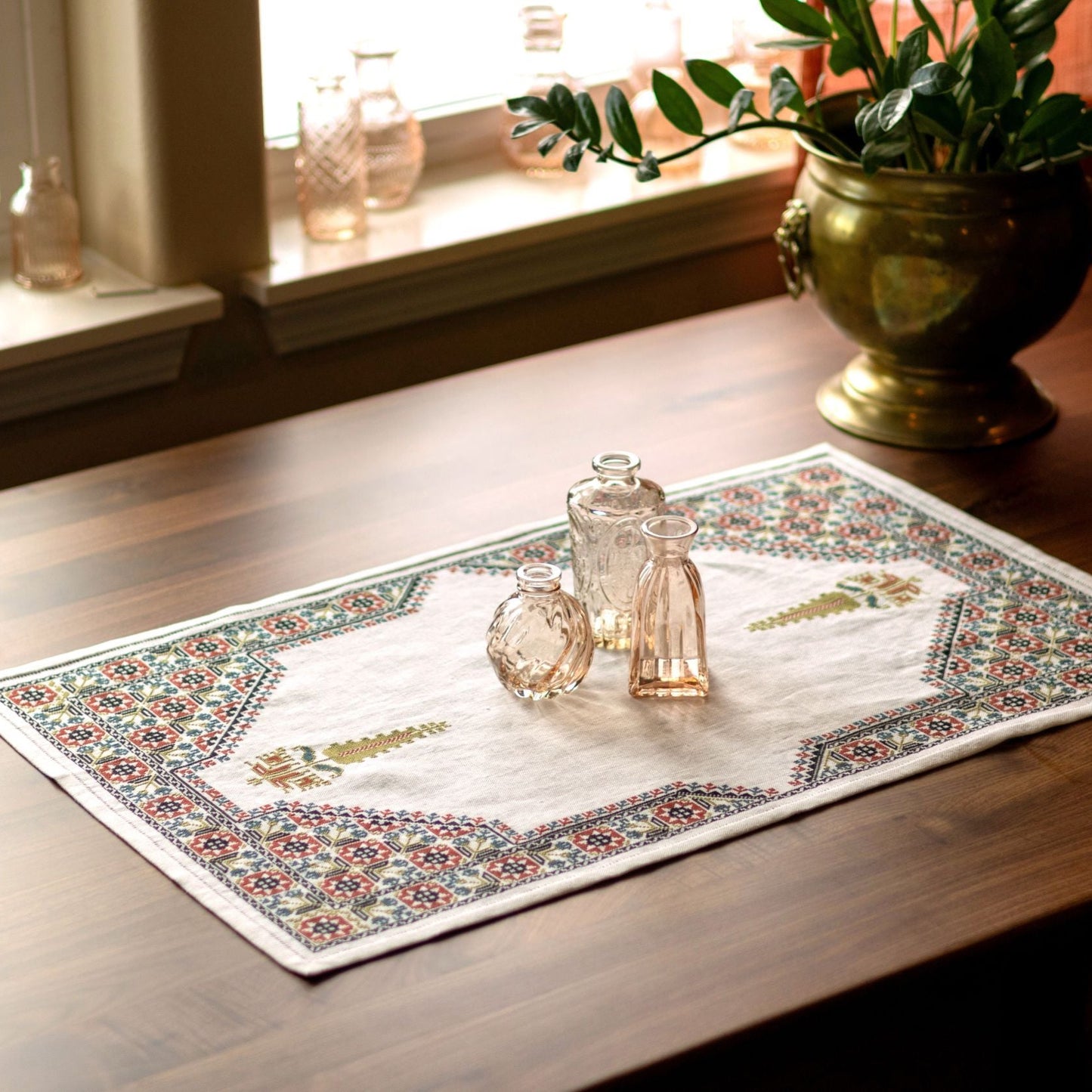 cross stitch folk embroidery table runner with stars, flowers, and cypress tree on white linen