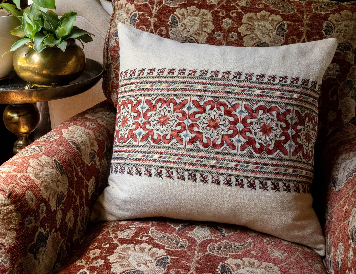 folk embroidery cushionwith red and black design