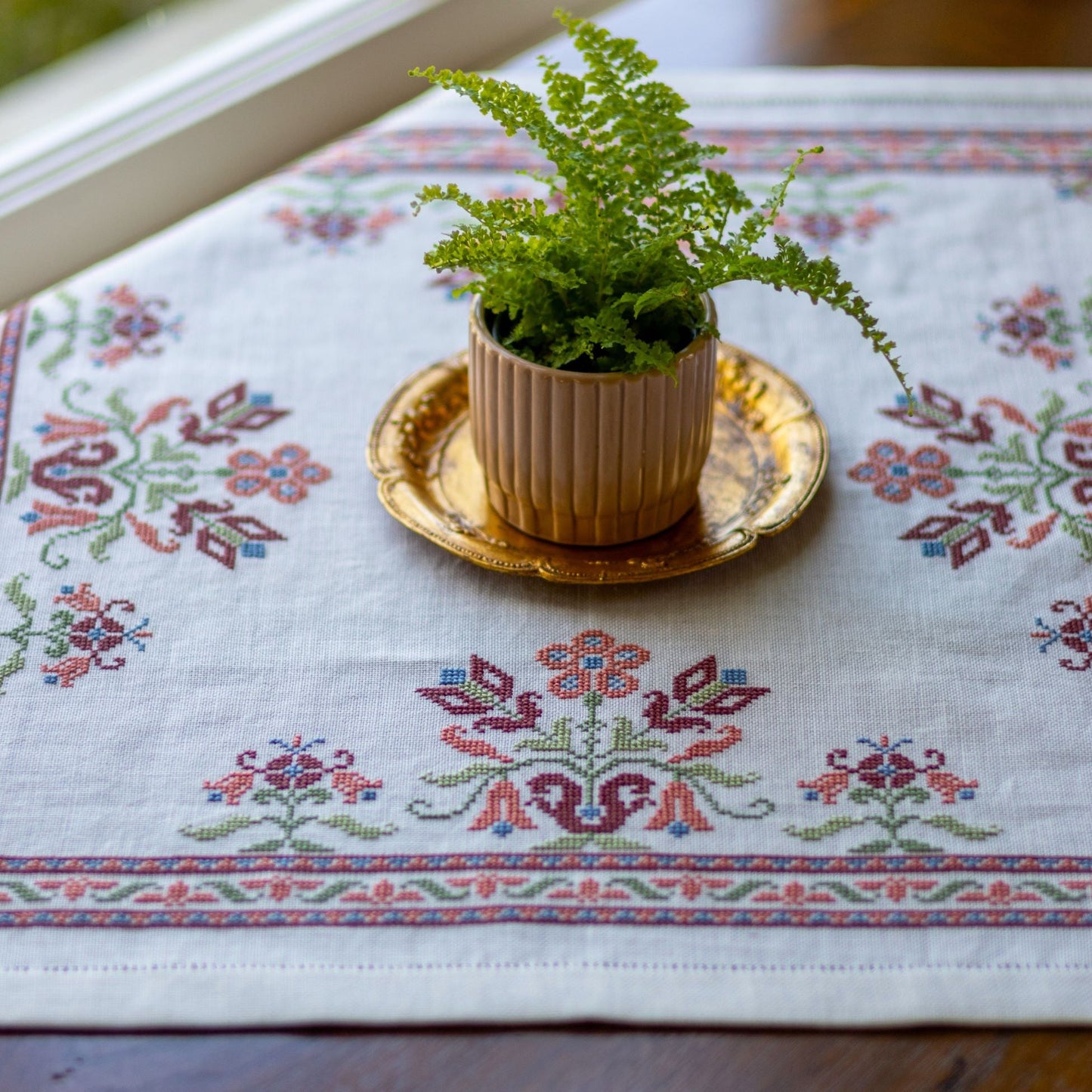 folk embroidery with pink floral design