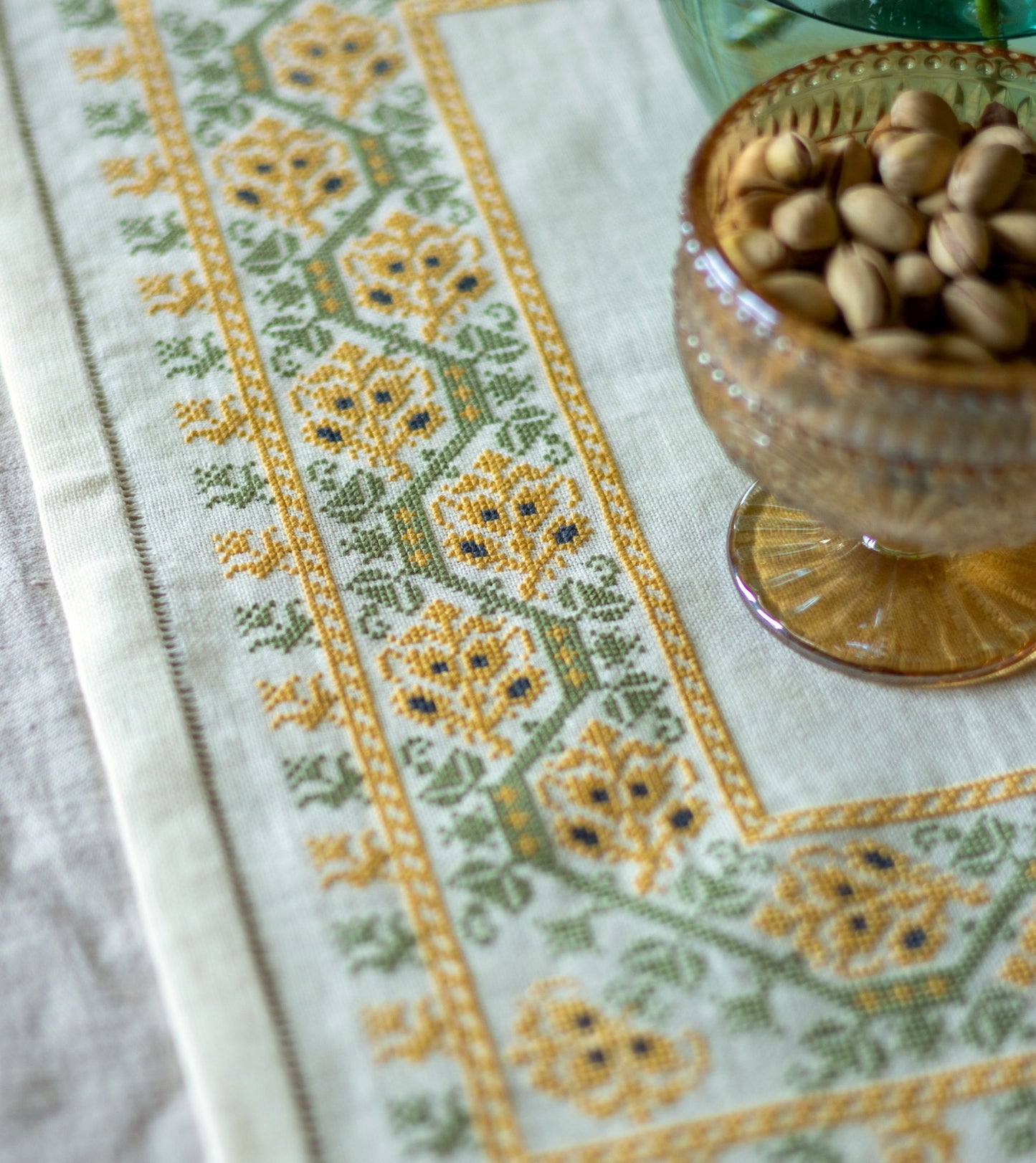 folk embroidery table linen with yellow and green floral design