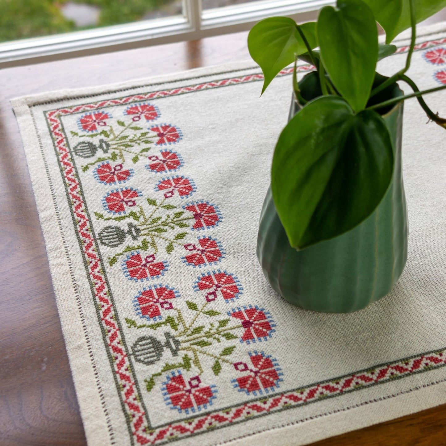 cross stitch folk embroidery with red poppy design
