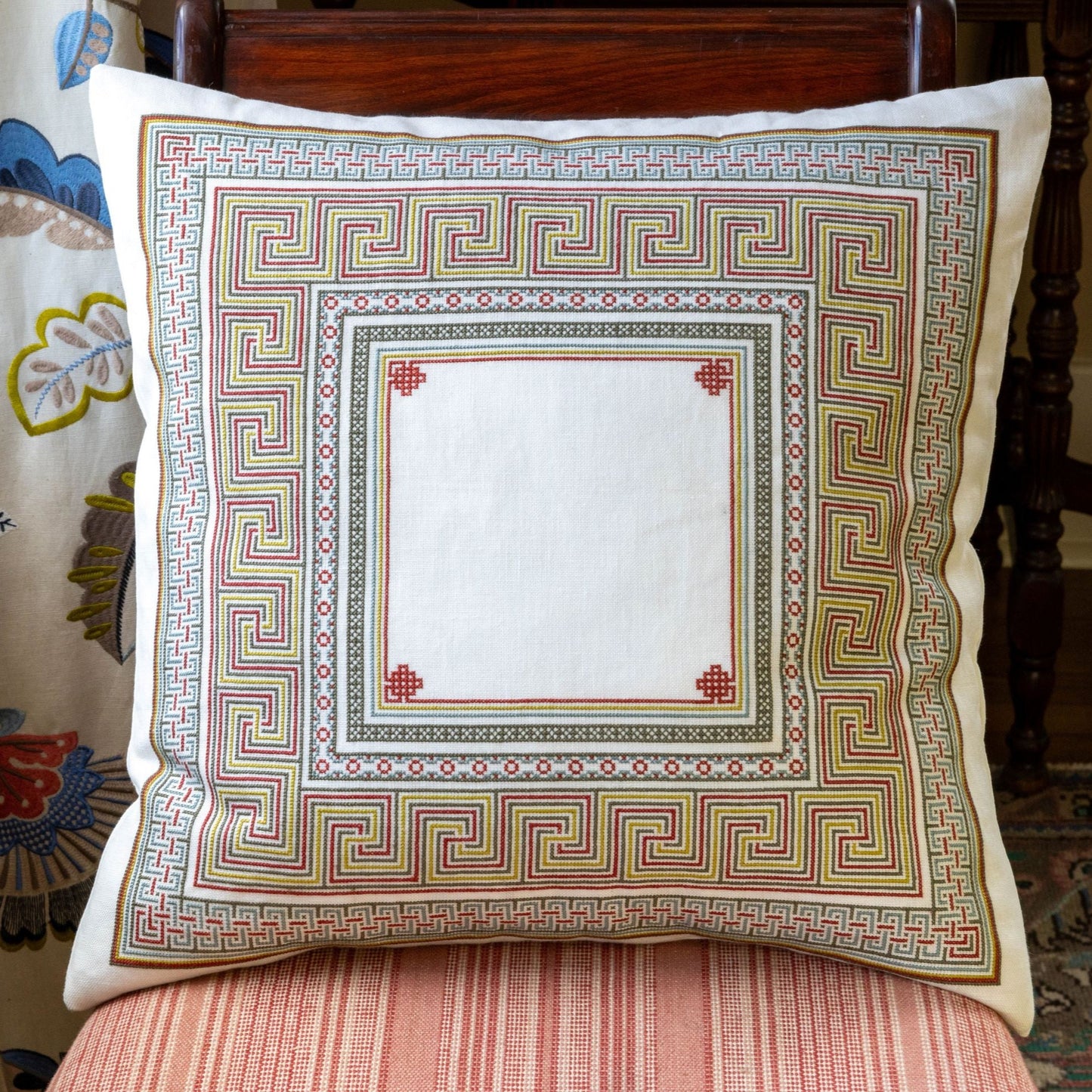 folk embroidery cushion with meander design