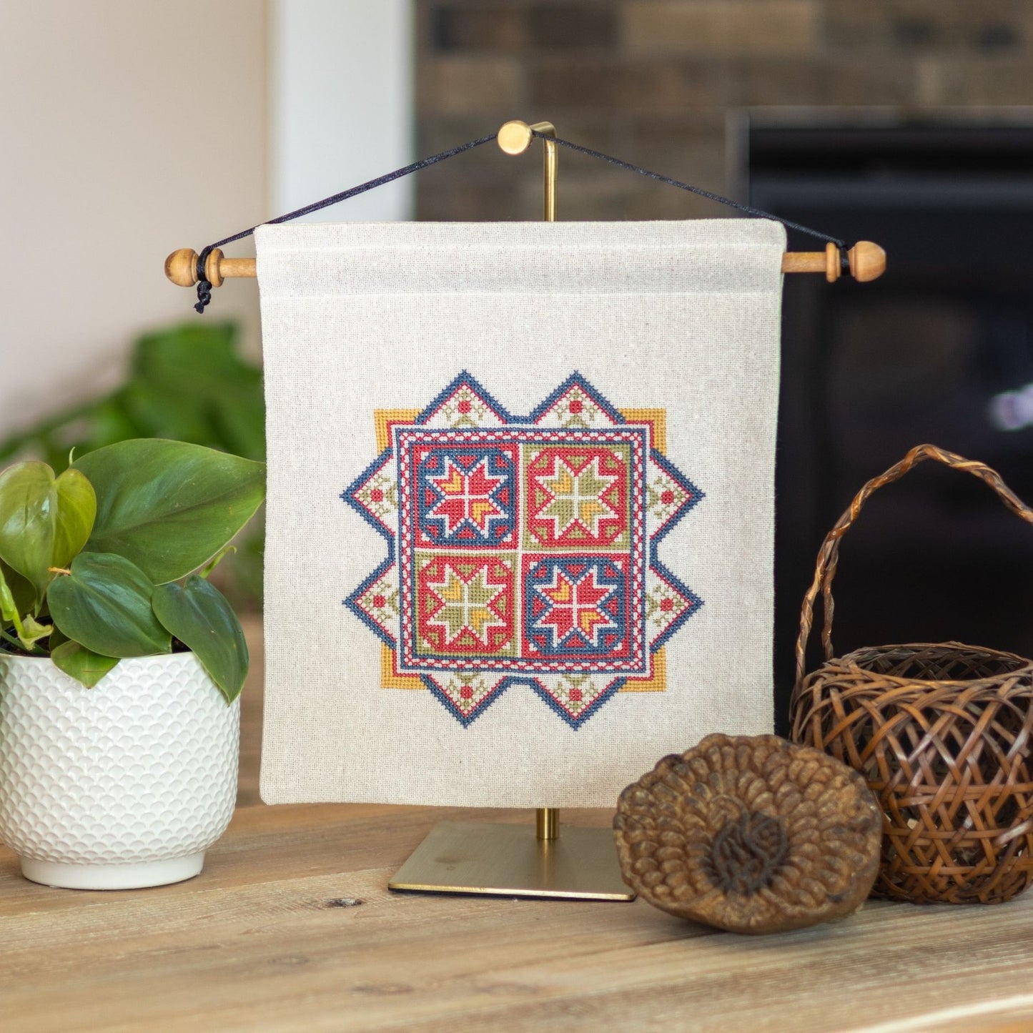 cross stitch embroidery with eight pointed stars inspired by Greek embroidery
