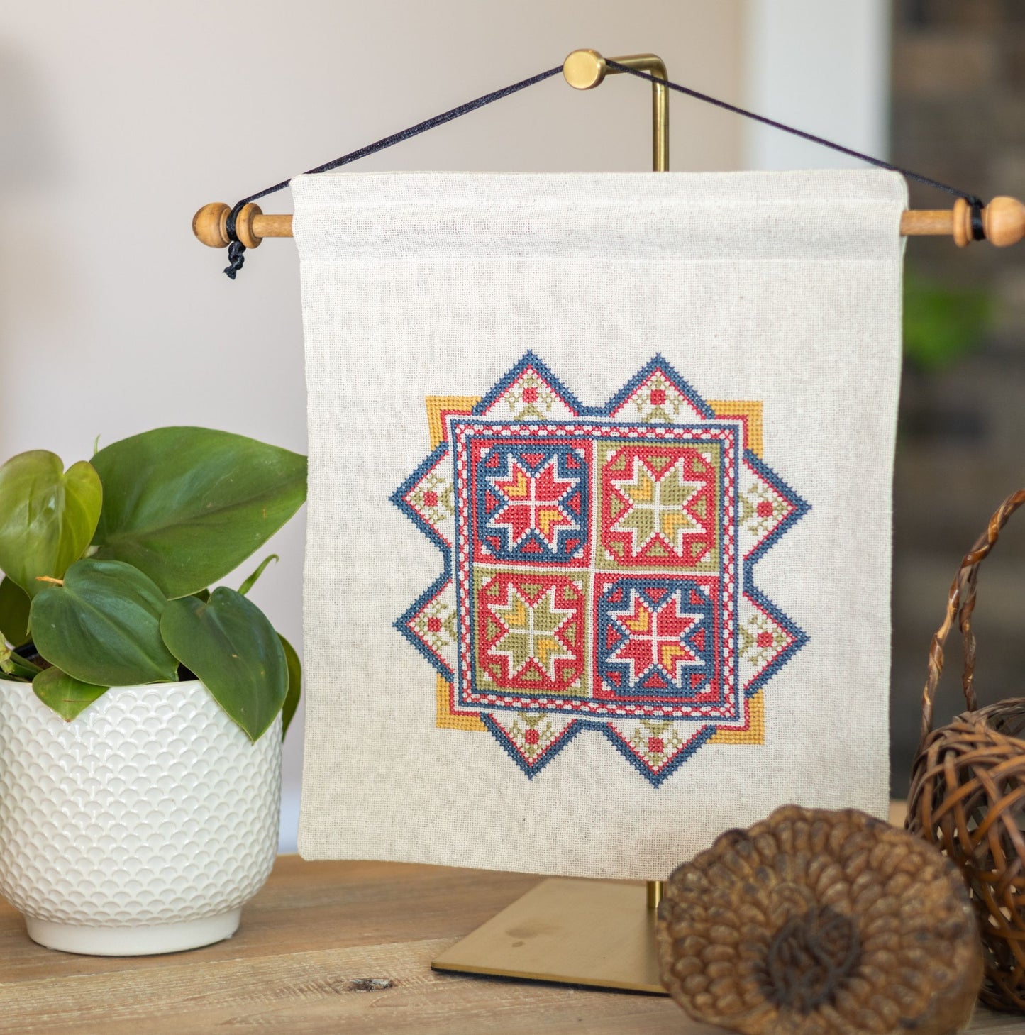 cross stitch embroidery with eight pointed stars inspired by Greek embroidery