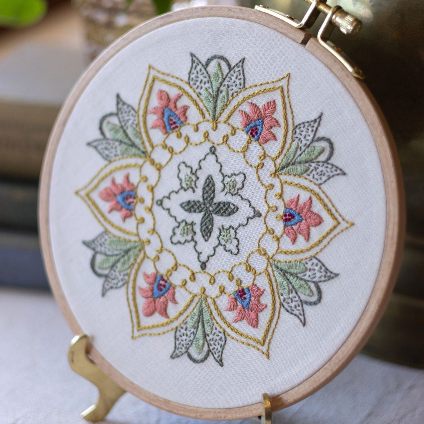 embroidery hoop with floral design in pink and green