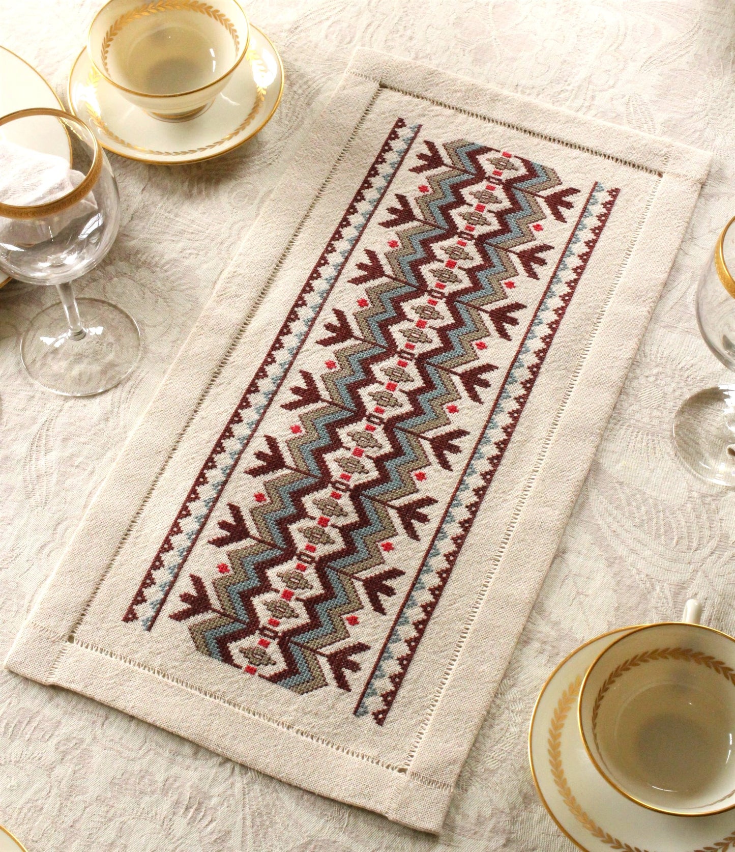 cross stitch folk embroidery table runner with chevron design