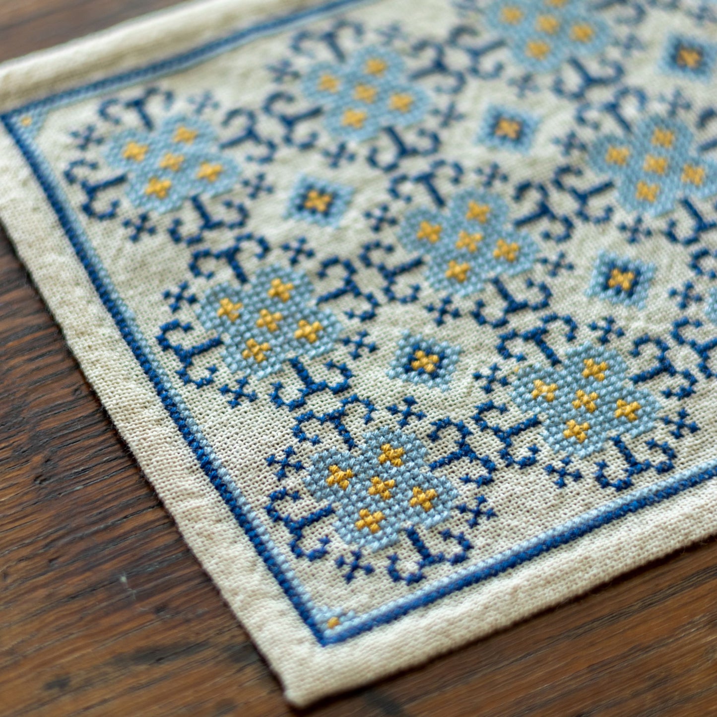 folk embroidery with blue flower design