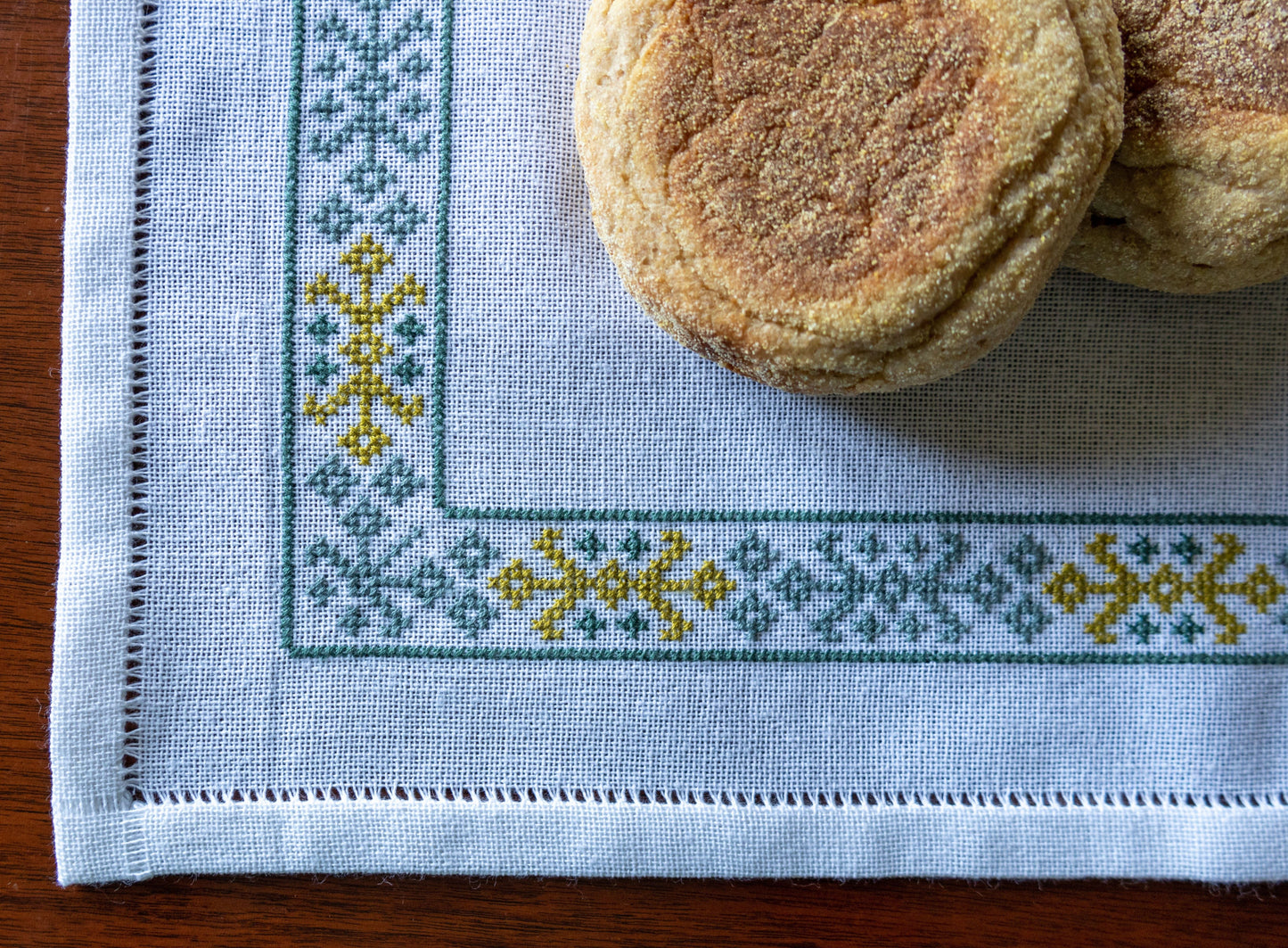 cloth with folk embroidery border with bread