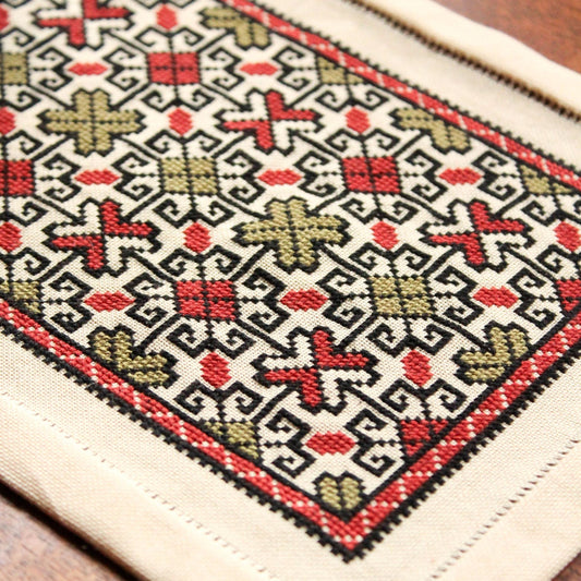 folk embroidery with repeating star pattern