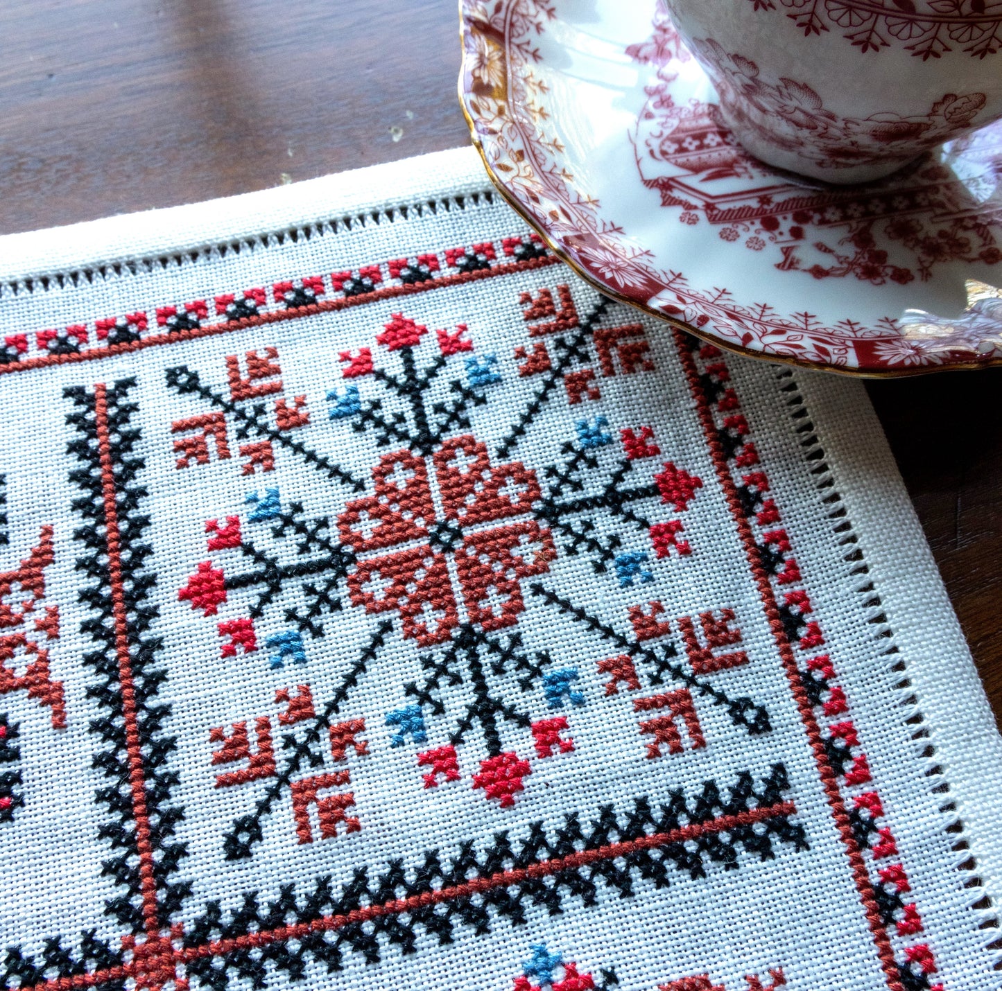 folk embroidery with red and black motifs