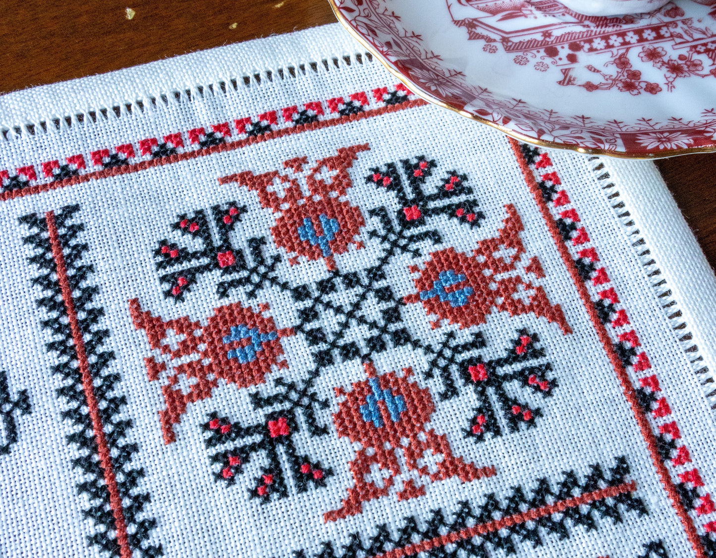 folk embroidery with red and black motifs