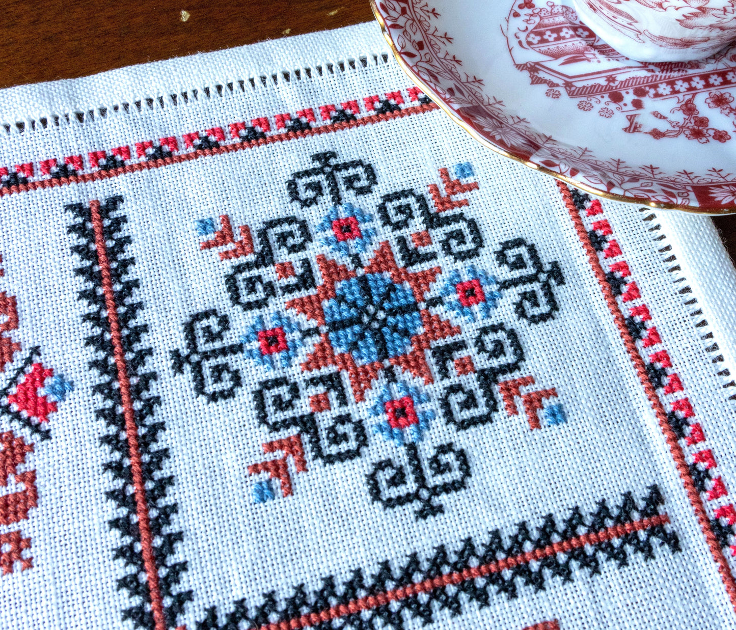 folk embroidery with red and black motifs