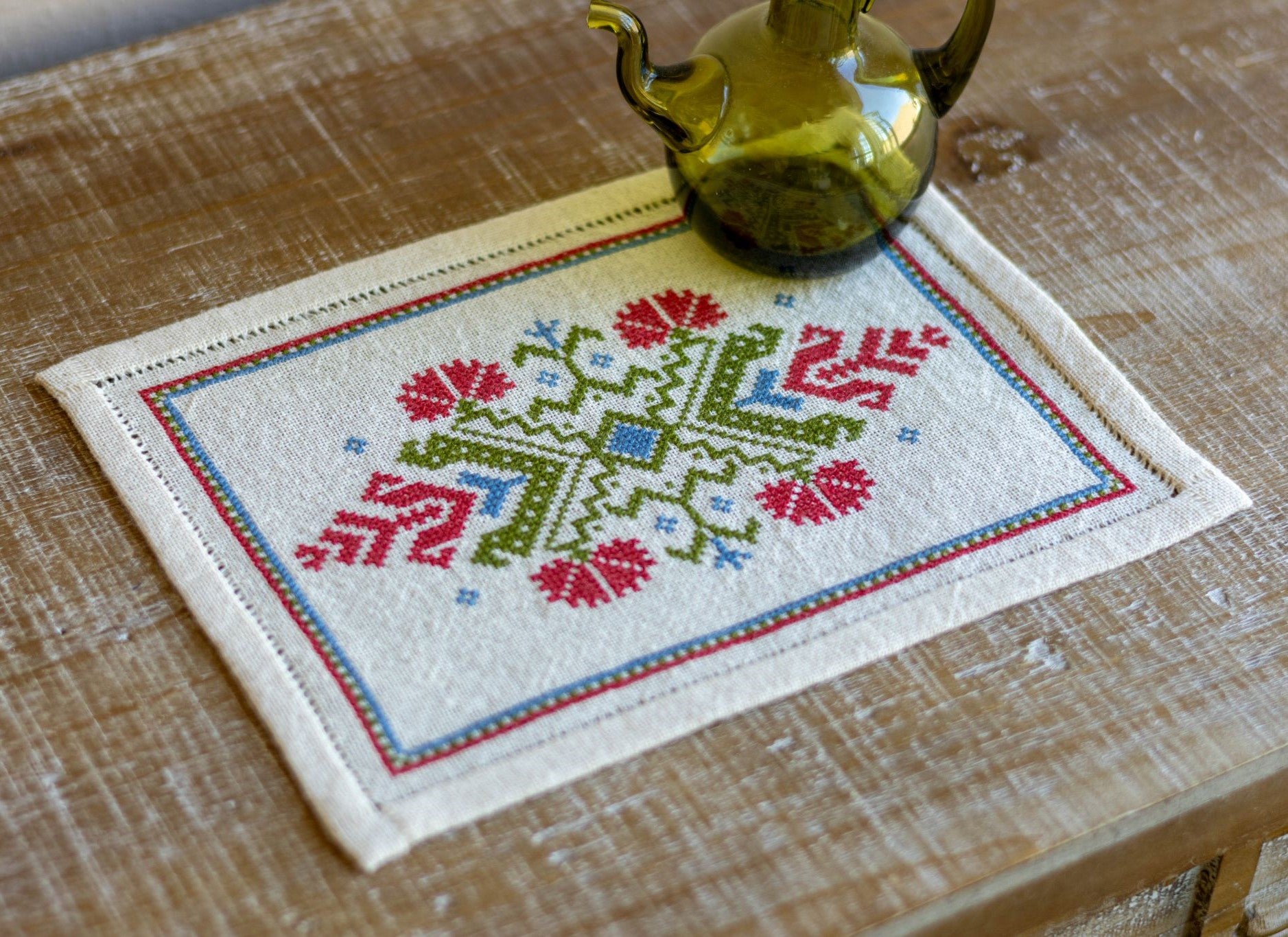 folk embroidery with red flower design