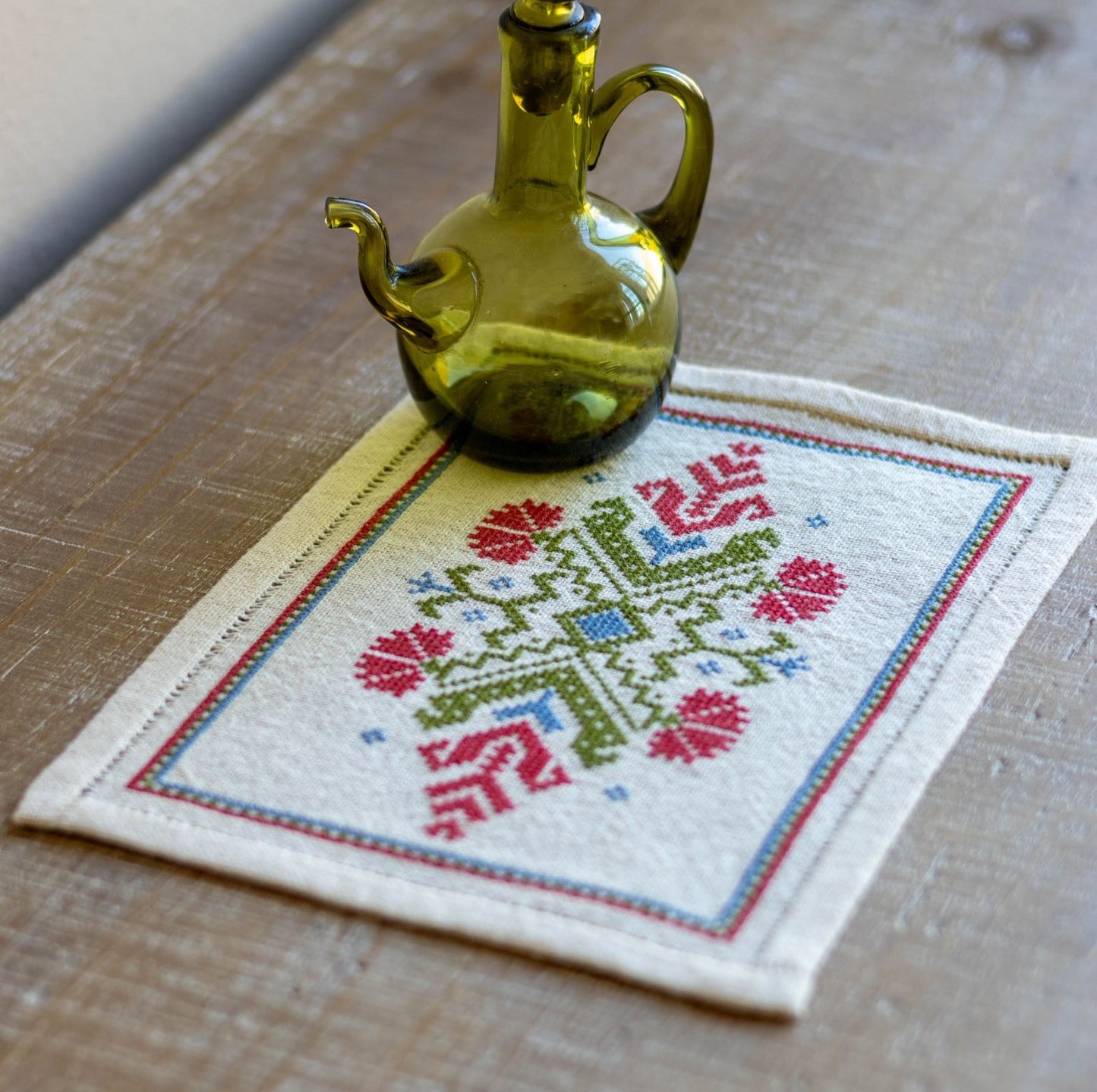 folk embroidery with red flower design