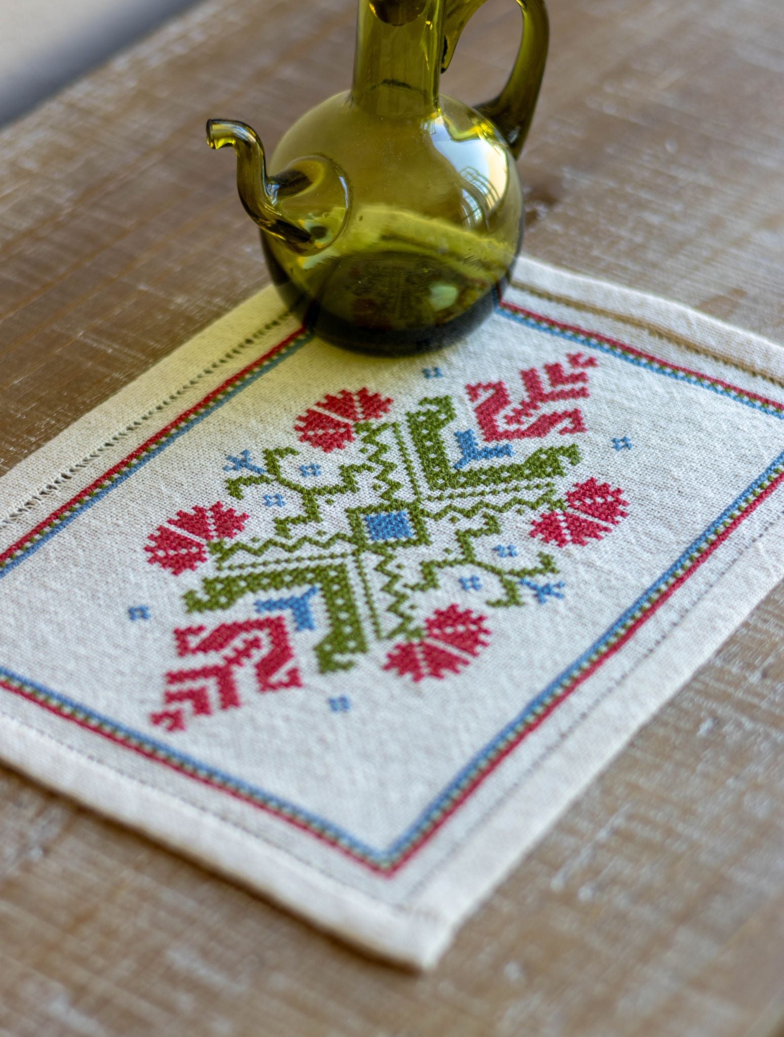 folk embroidery with red flower design