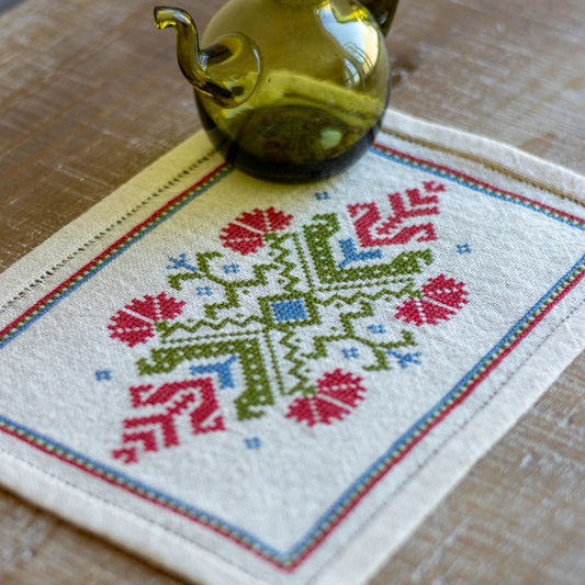 folk embroidery with red flower design