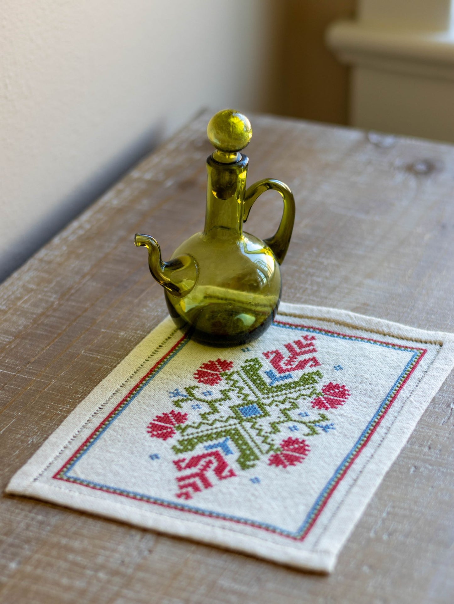 folk embroidery with red flower design