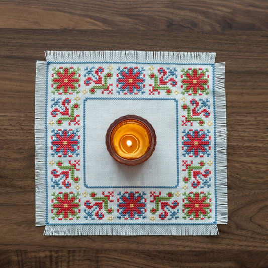 folk embroidery with red green and blue flower design