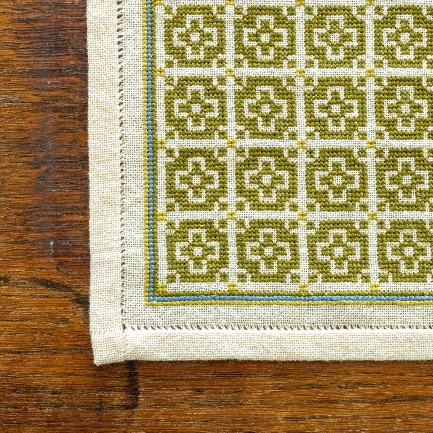 folk embroidery with green mosaic design