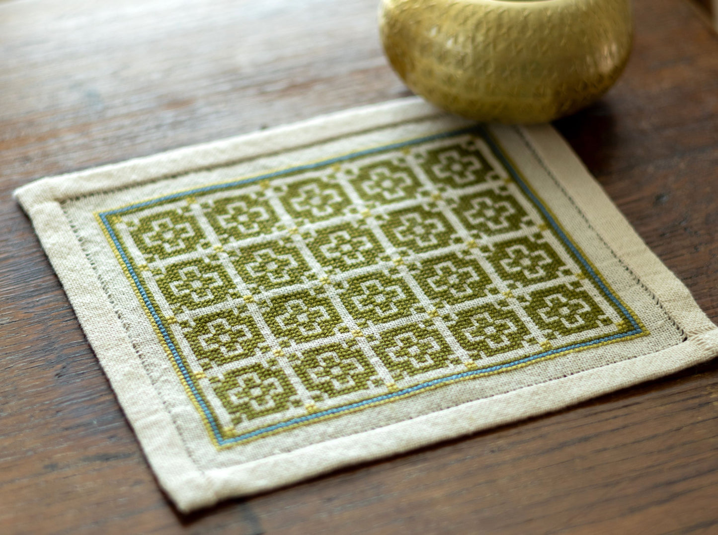 folk embroidery with green mosaic design