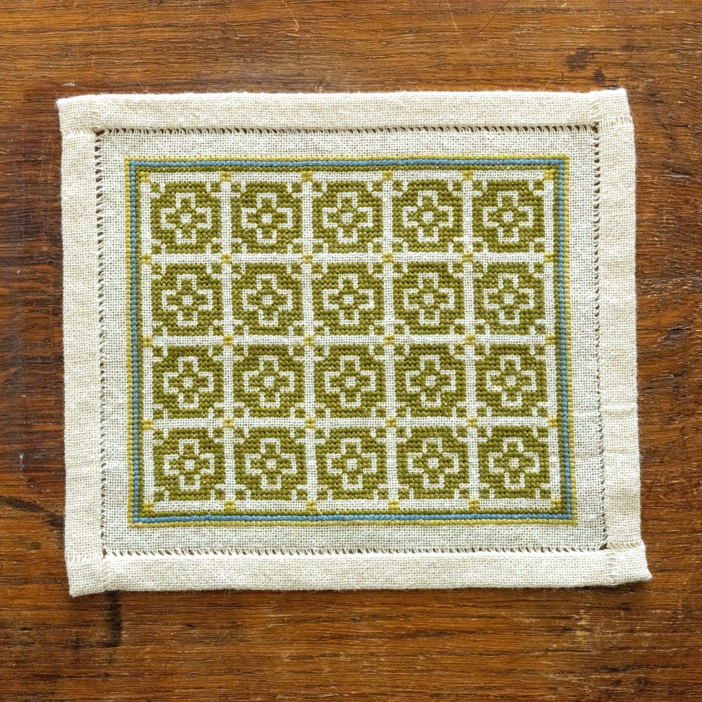 folk embroidery with green mosaic design