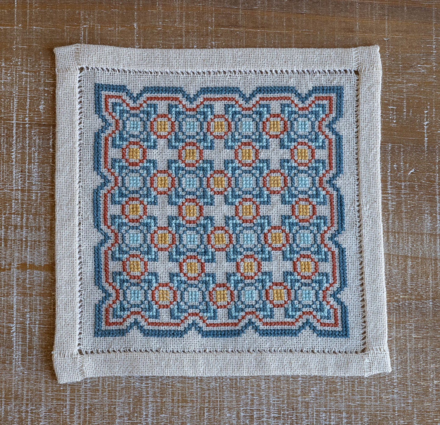 greek folk embroidery with repeating tile design