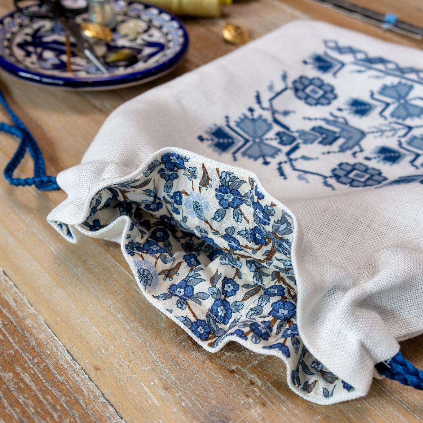 cross stitch bag with blue floral design