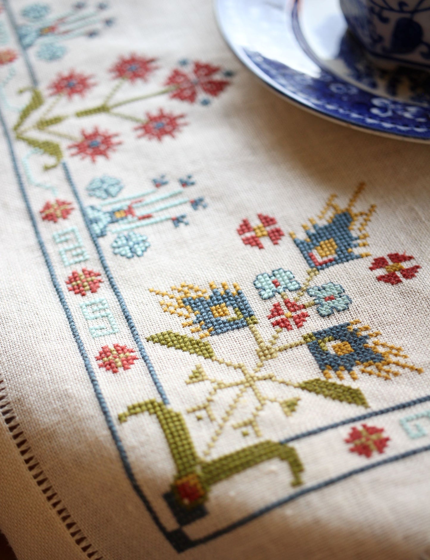 folk embroidery with blue floral design