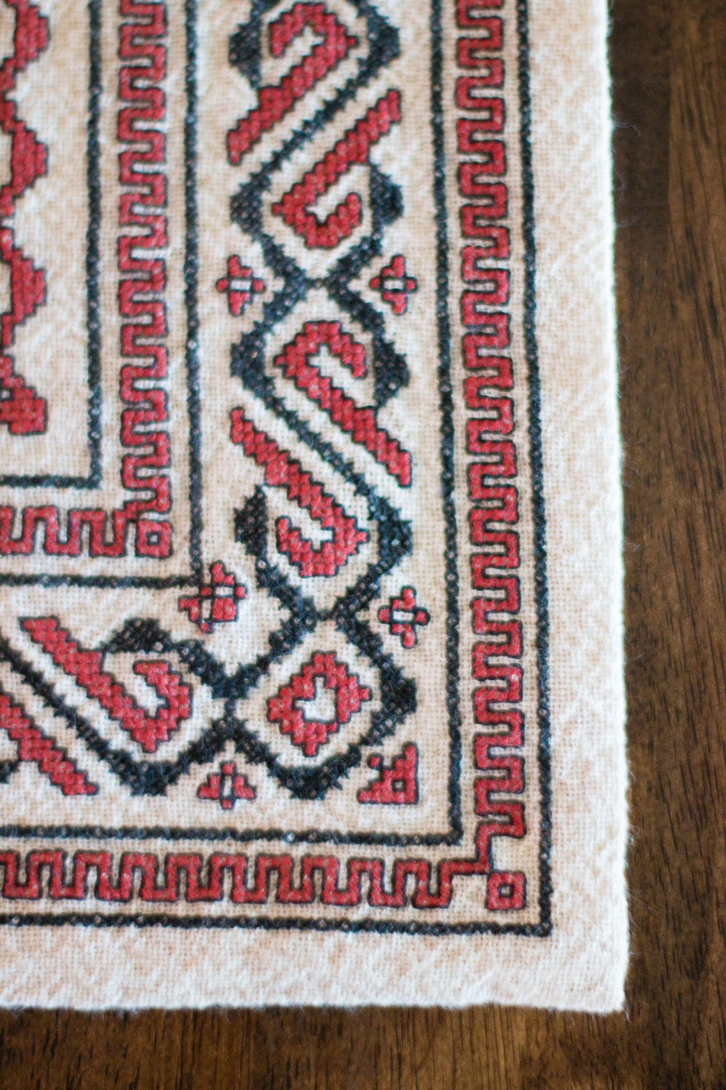 folk embroidery table runner in black and red