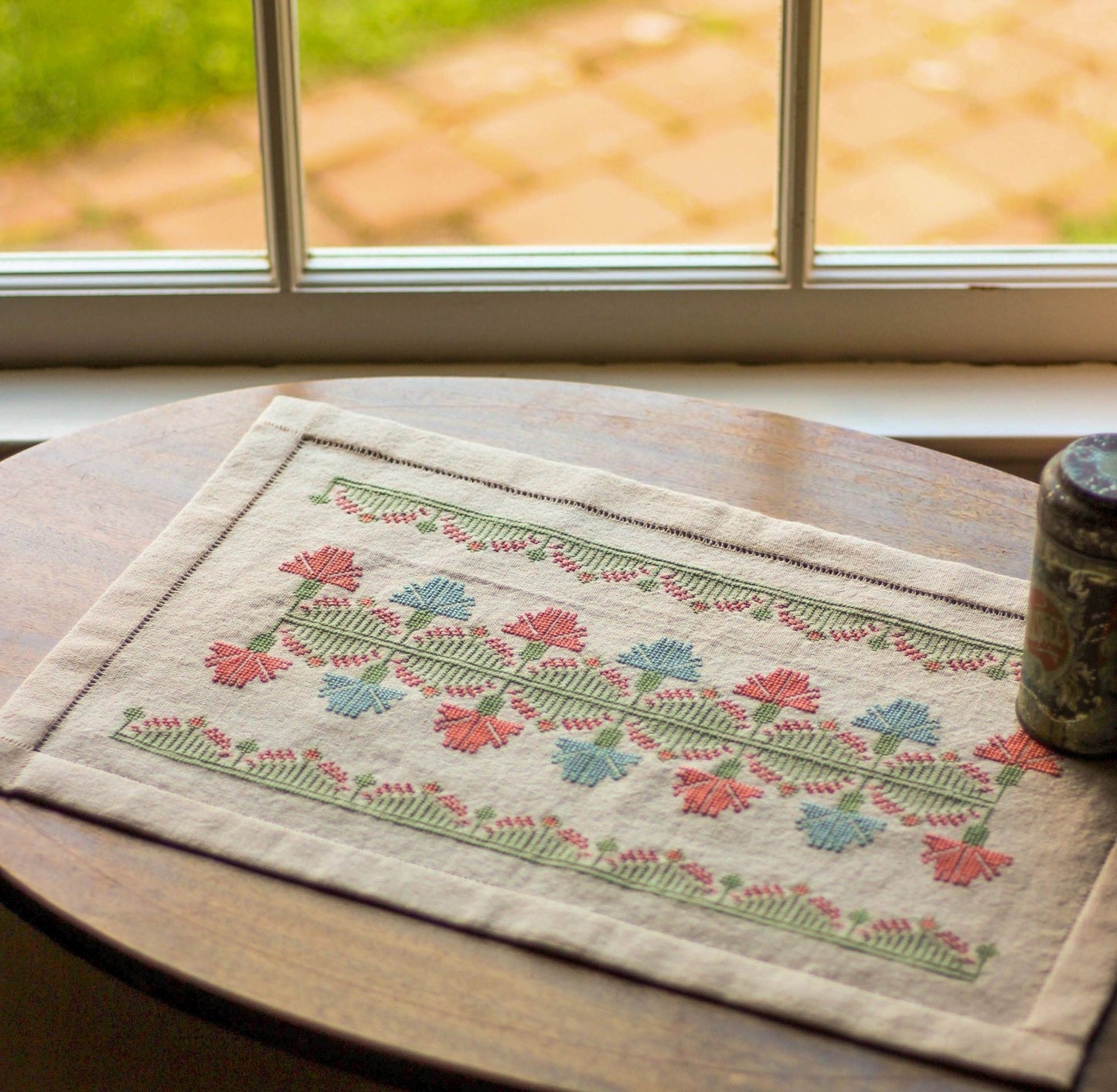 folk embroidery with pink and blue floral design