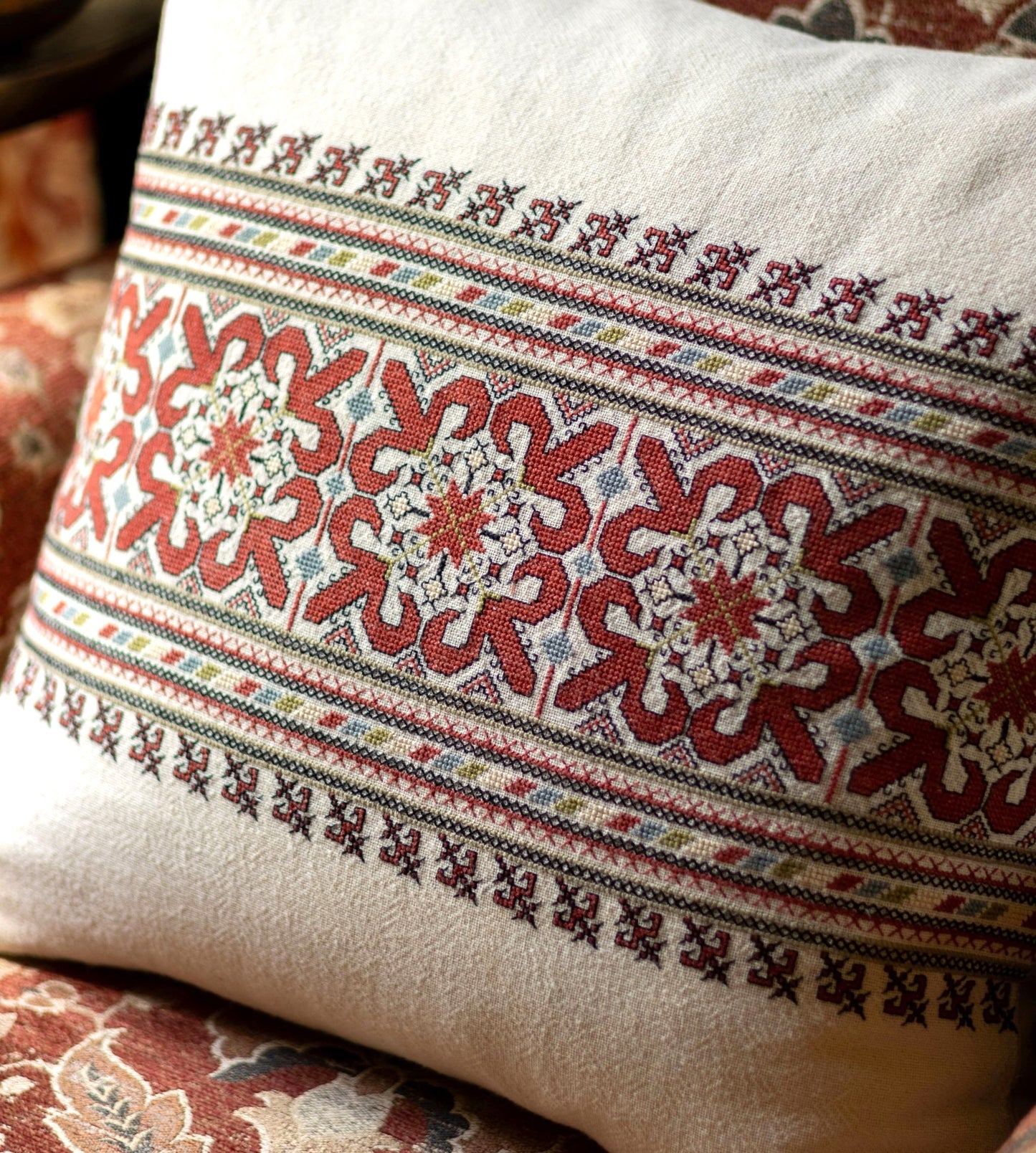 folk embroidery cushionwith red and black design