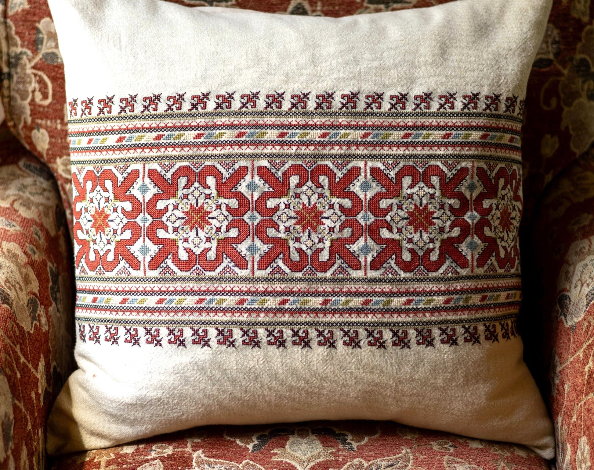 folk embroidery cushionwith red and black design