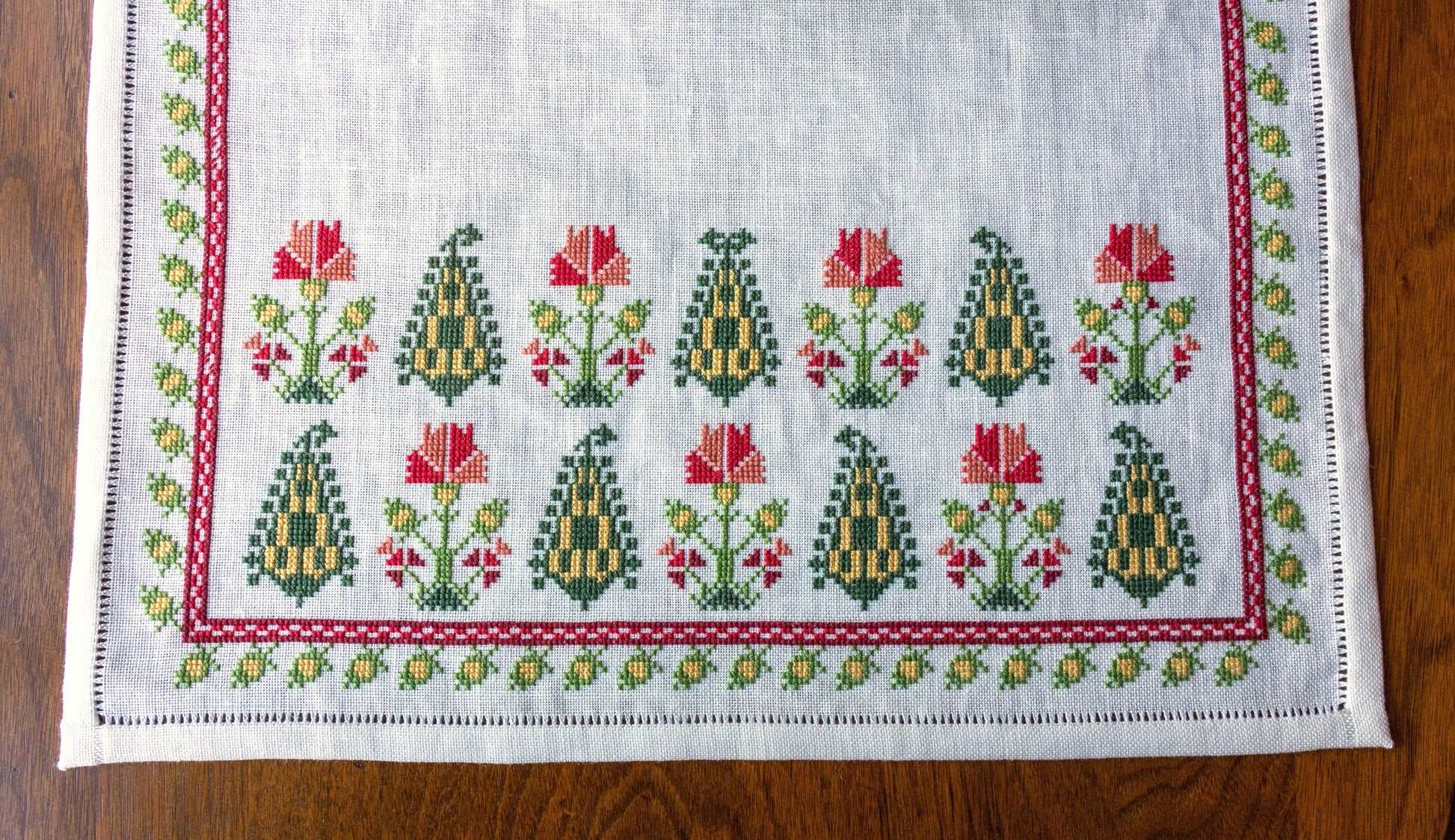 folk embroidery table runner with cypress trees and flowers