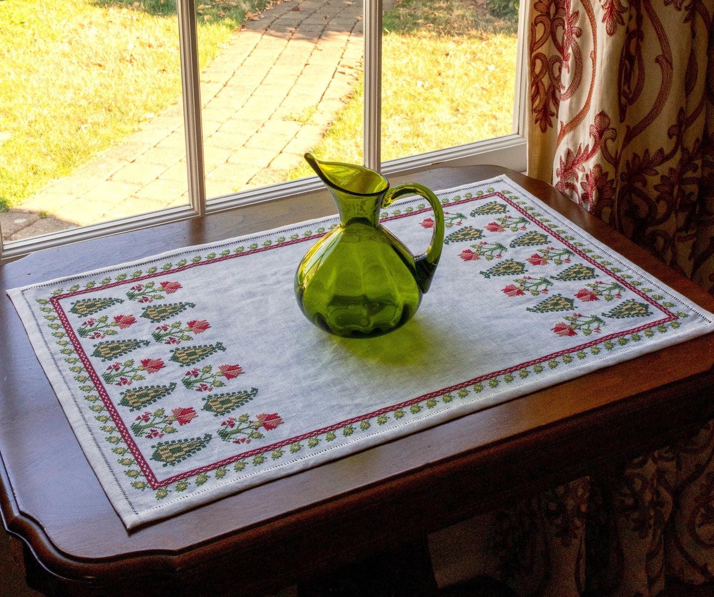 folk embroidery table runner with cypress trees and flowers