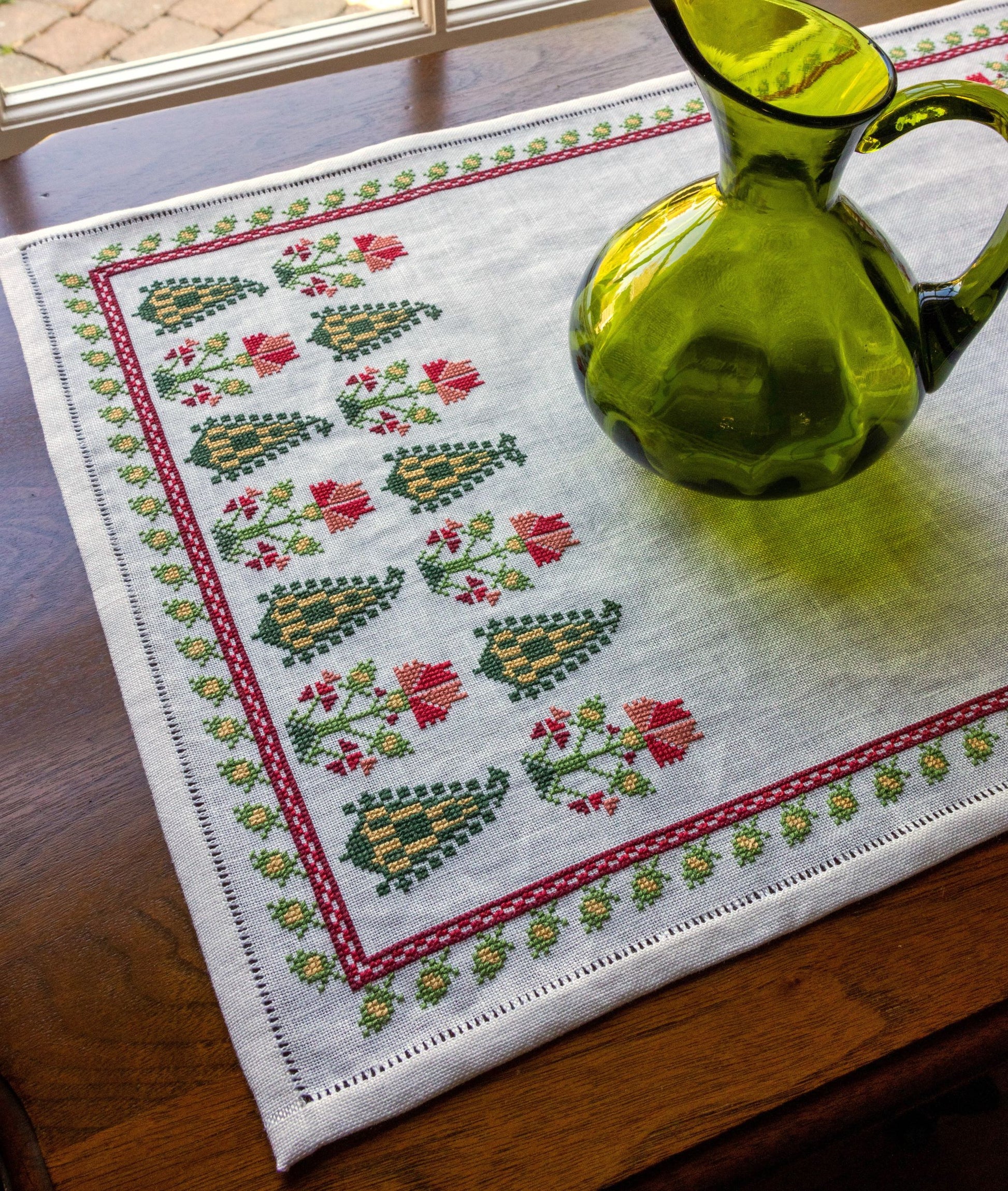 folk embroidery table runner with cypress trees and flowers