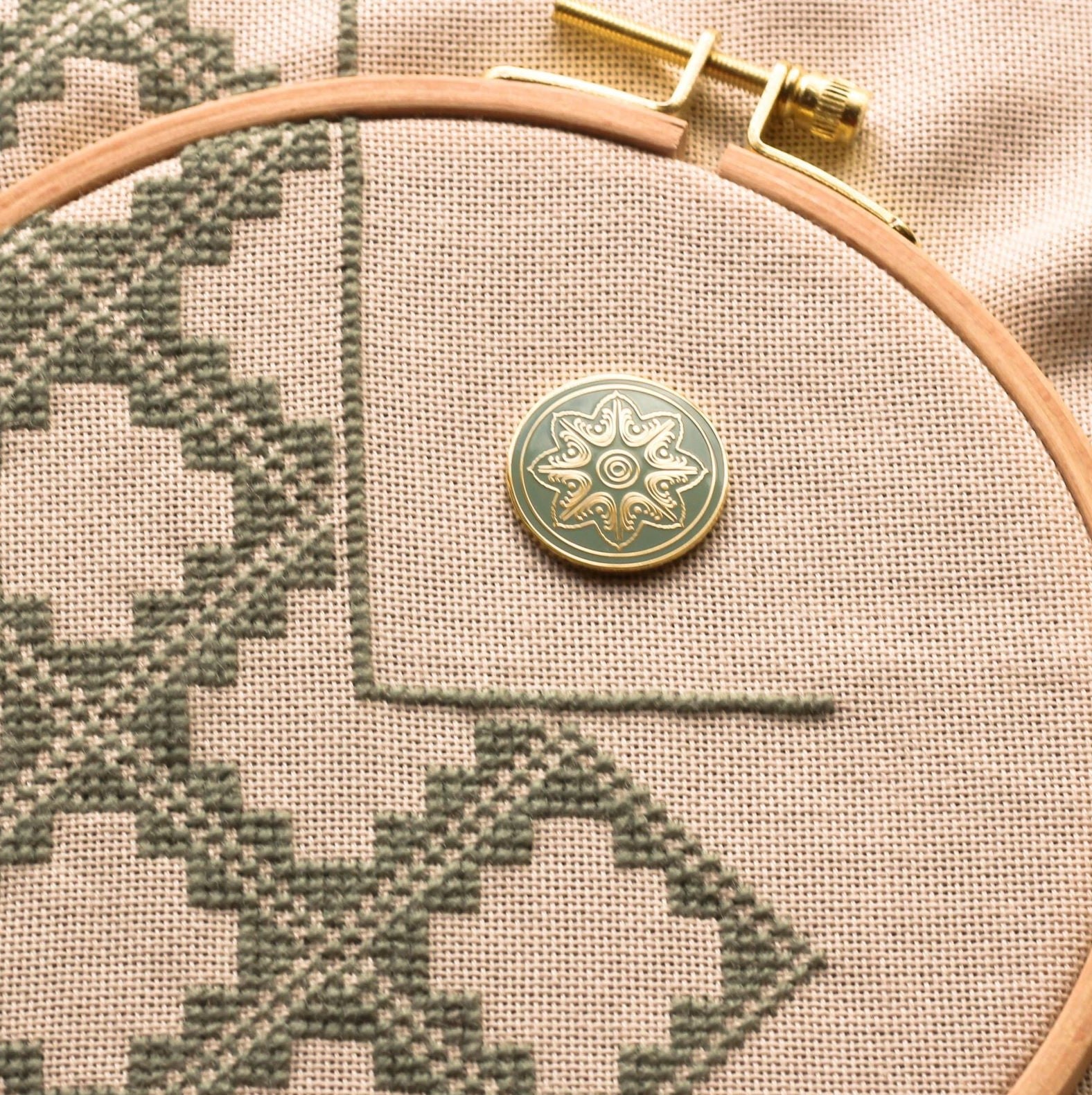 folk embroidery with embroidery needleminder in celadon green