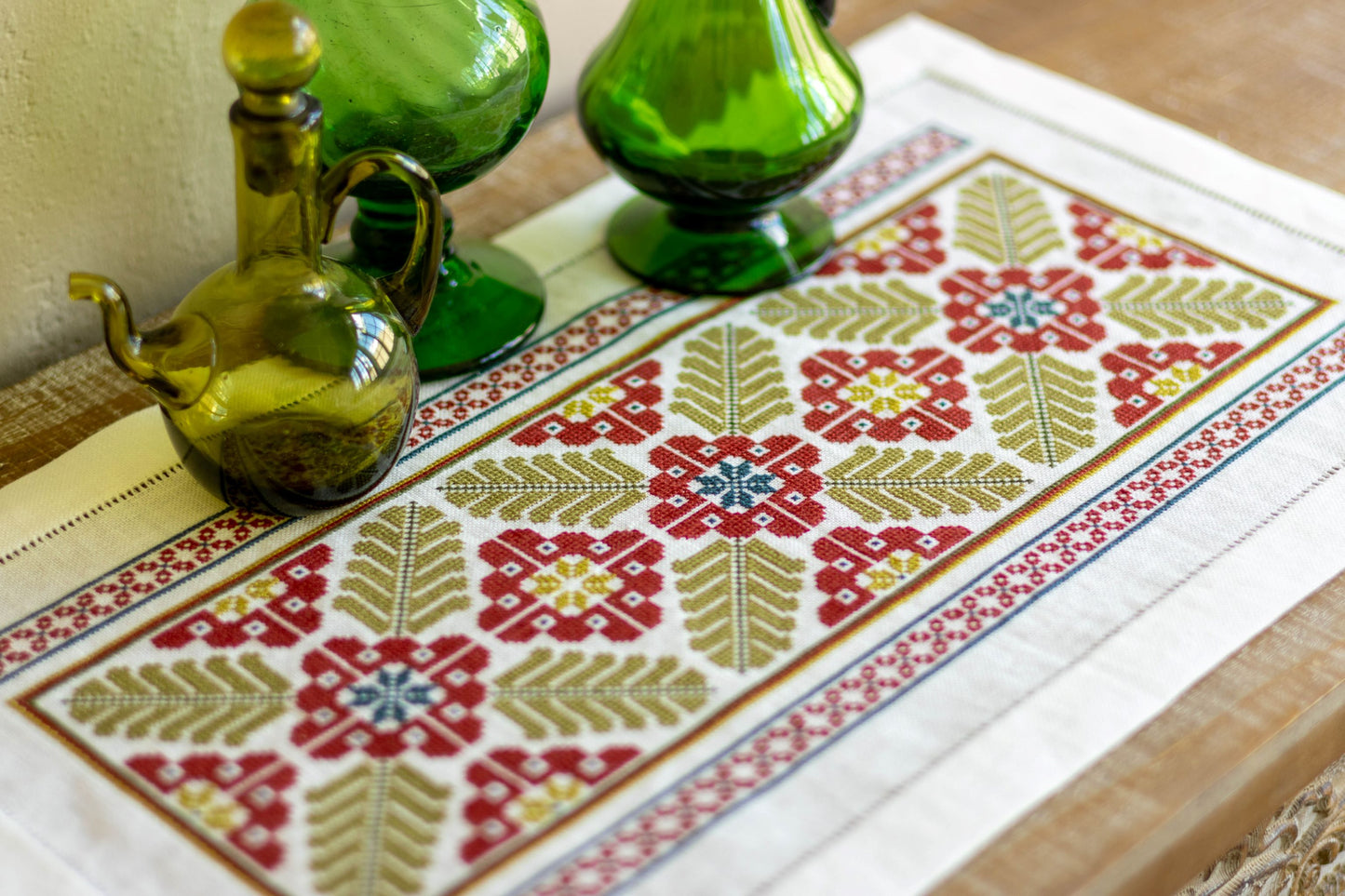 folk embroidery table runner with broad leaf design