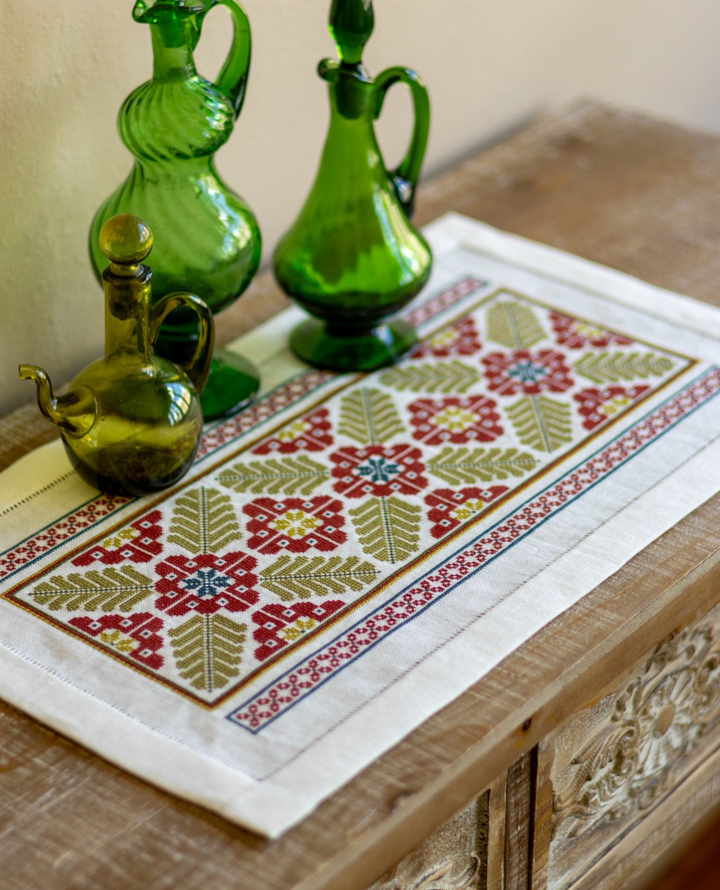 folk embroidery table runner with broad leaf design