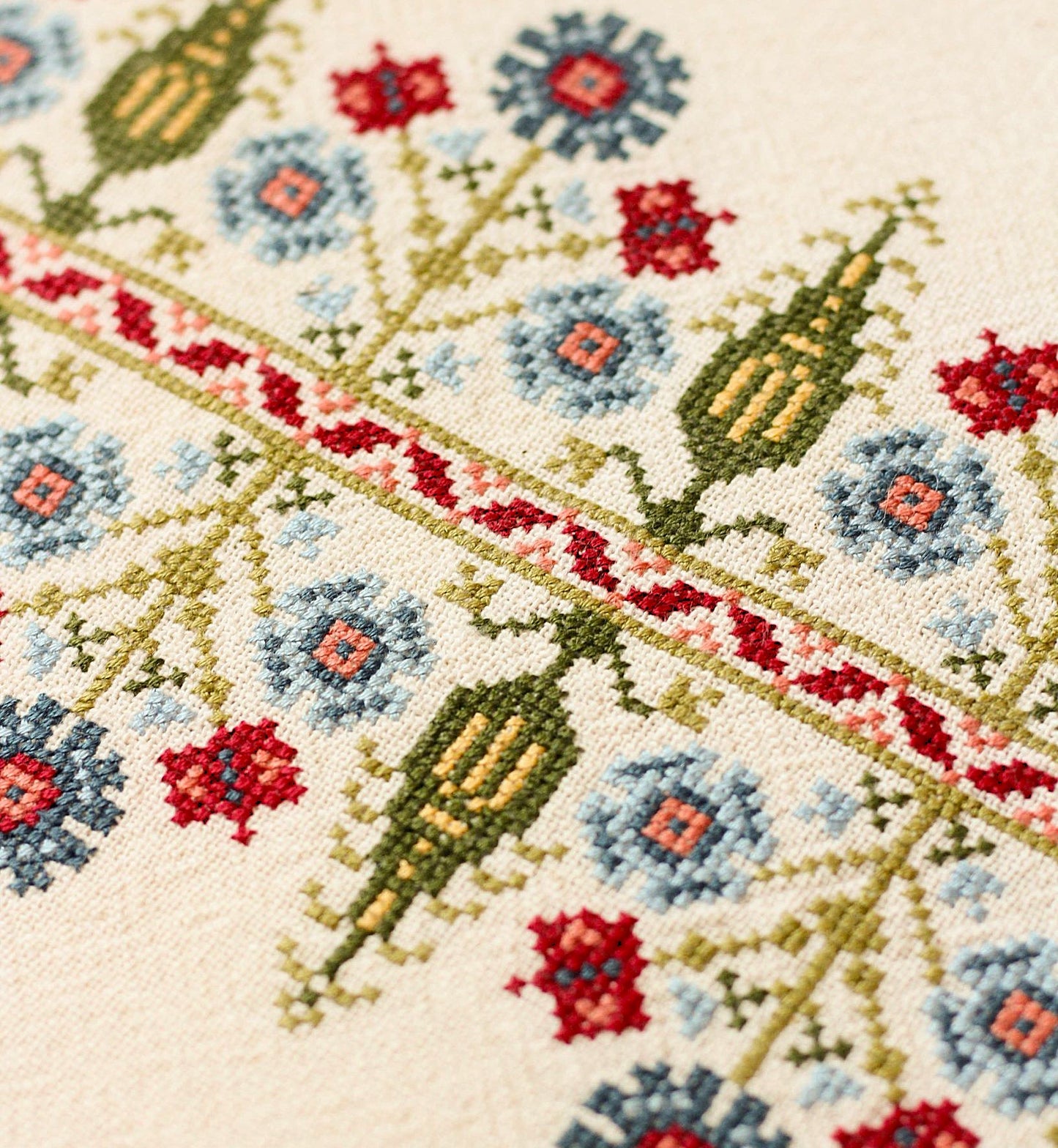 folk embroidery with tree and floral design