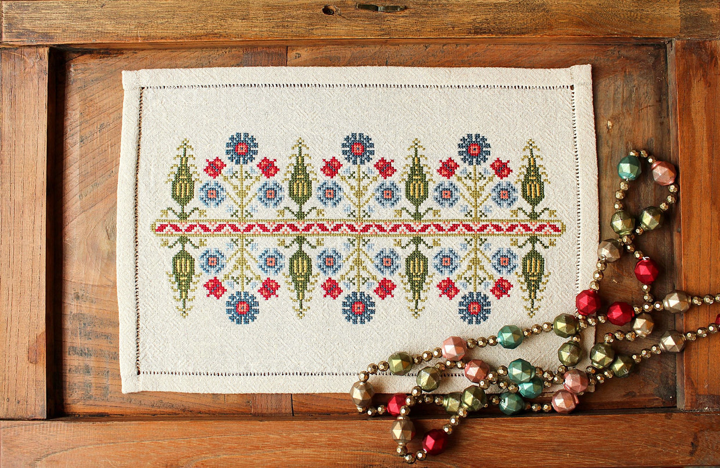 folk embroidery with tree and floral design