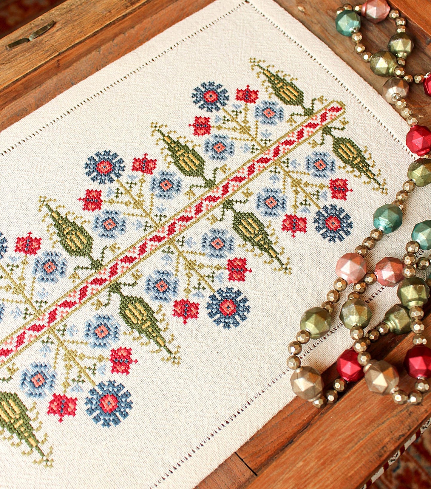 folk embroidery with tree and floral design