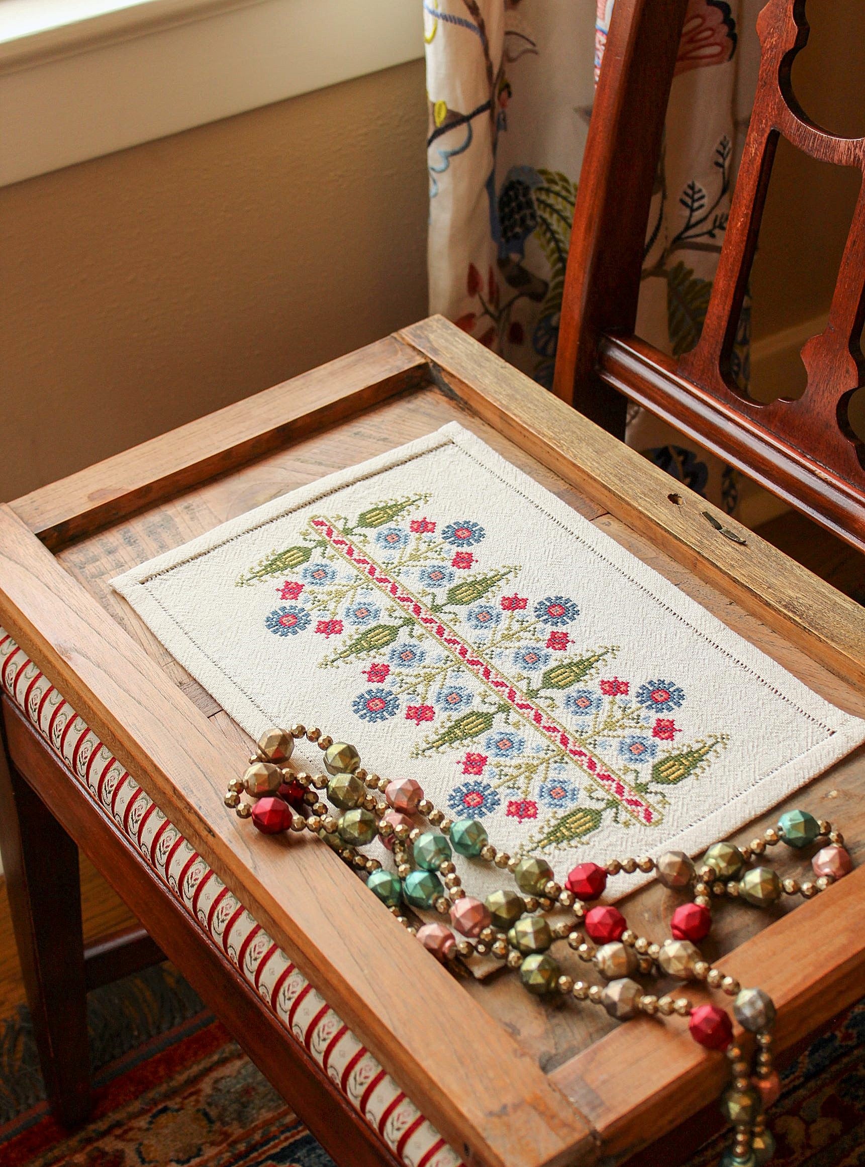 folk embroidery with tree and floral design