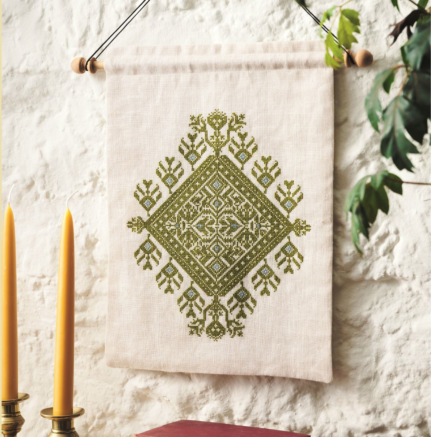 folk embroidery wall hanging with green design from everyday folk book