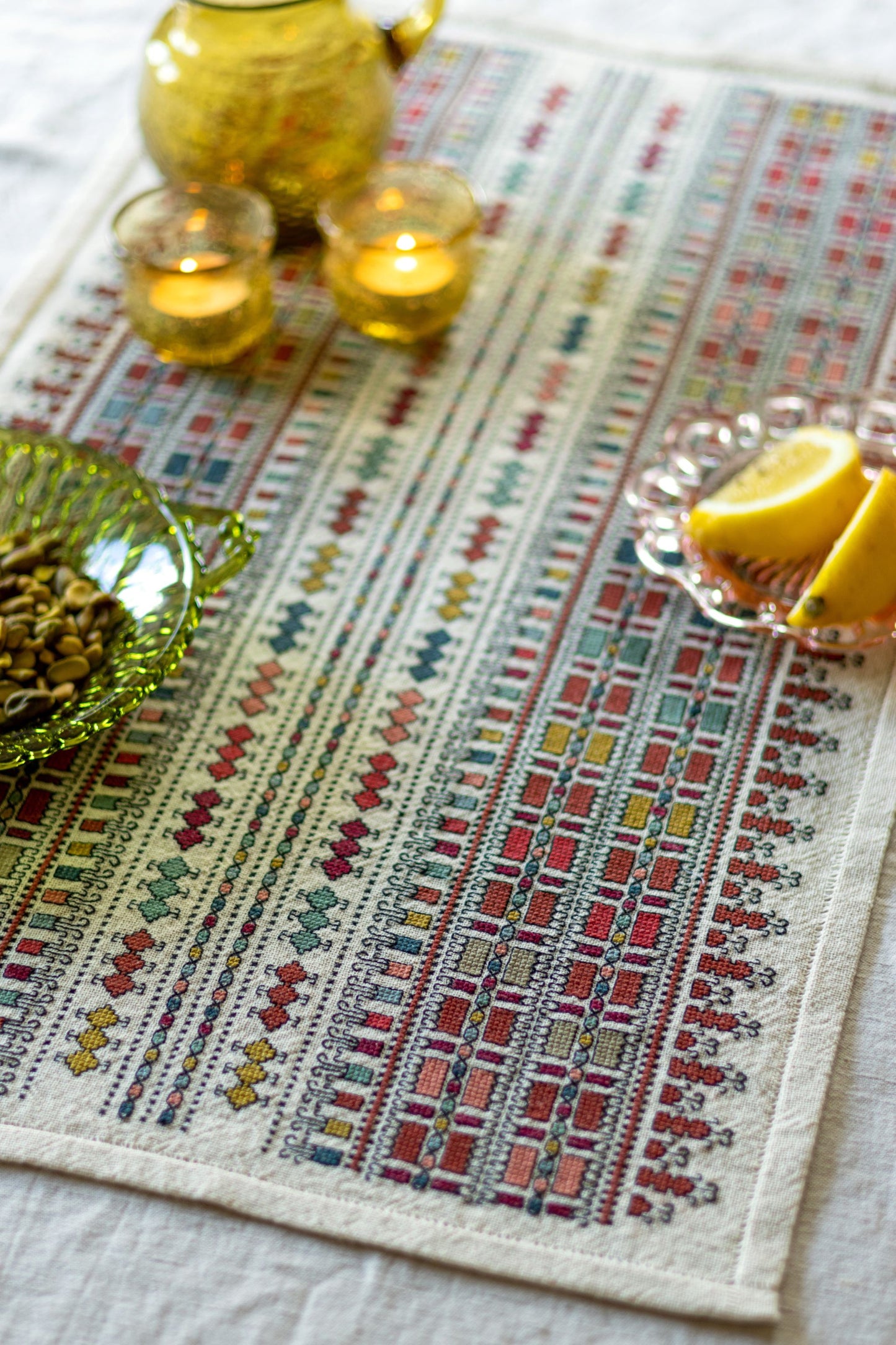 folk embroidery table runner with geometric pattern