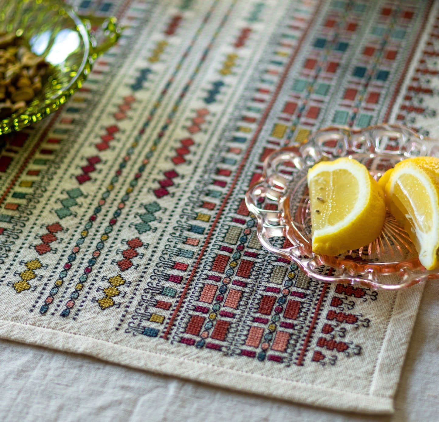 folk embroidery table runner with geometric pattern